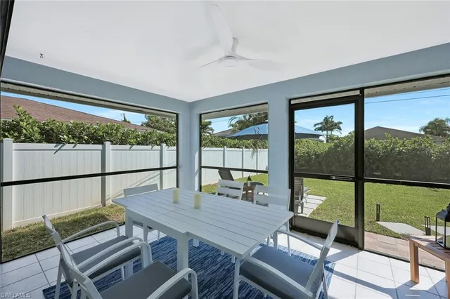 a bedroom with 2 bed and a window