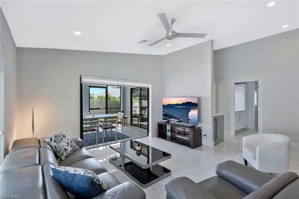 a living room with furniture and a large window