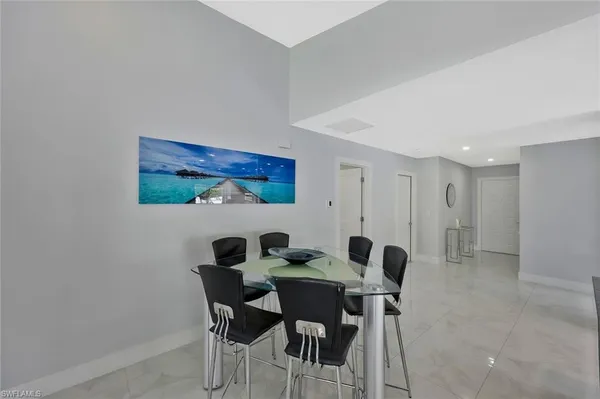 a kitchen with stainless steel appliances granite countertop a sink counter space and refrigerator