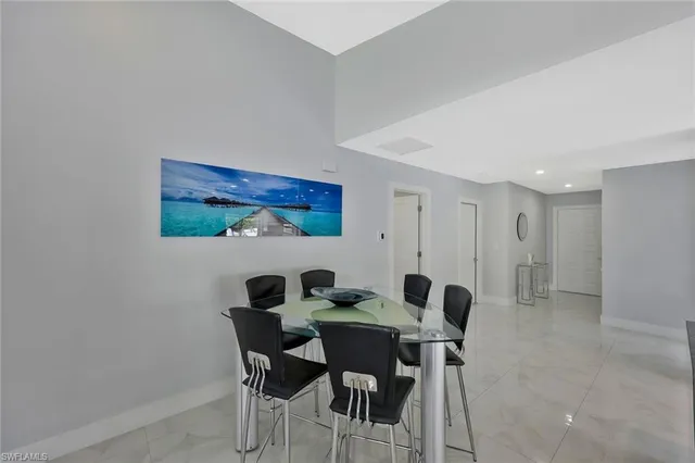 a kitchen with stainless steel appliances granite countertop a sink counter space and refrigerator