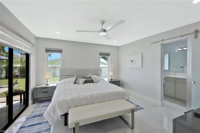a view of a dining room with furniture and a potted plant