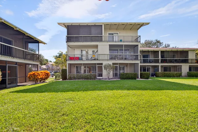 a view of a building with a yard