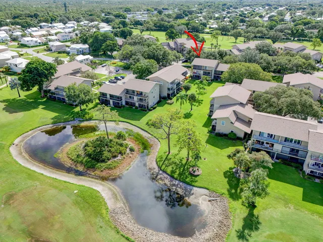 a view of a lake with a house in the background