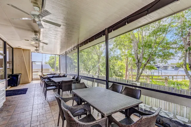a view of a dining room with furniture window and outside view