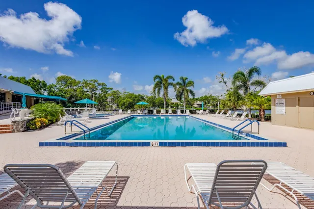 a living room with lots of furniture and a large window