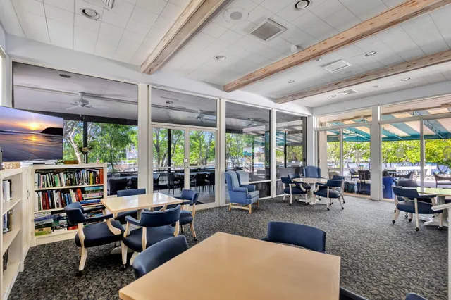 a view of a house with a yard porch and sitting area