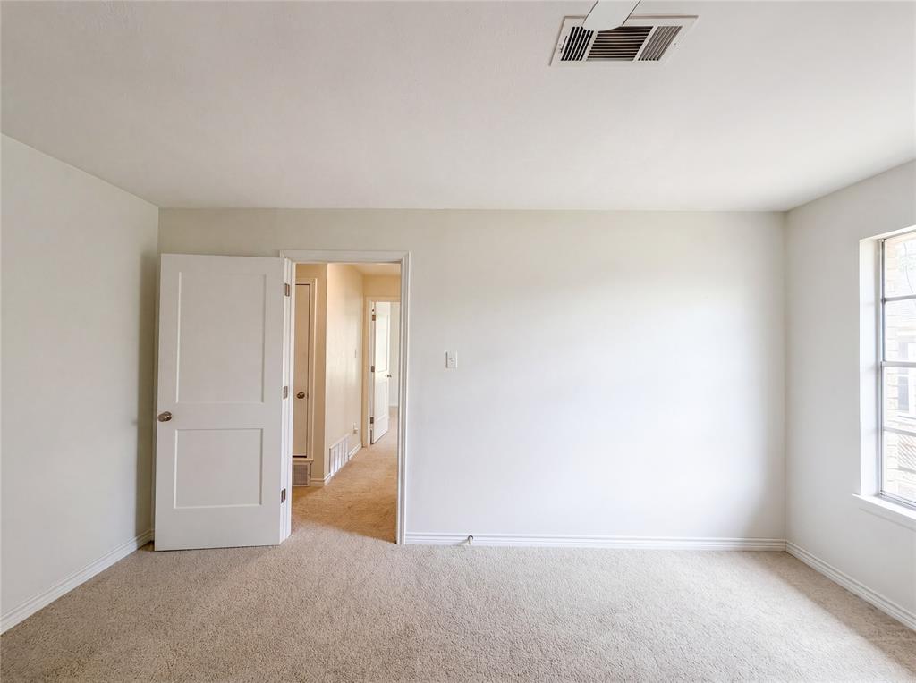 205 West Decatur Street Chico, TX 76431 - Photo 17 of 19 an empty room with windows