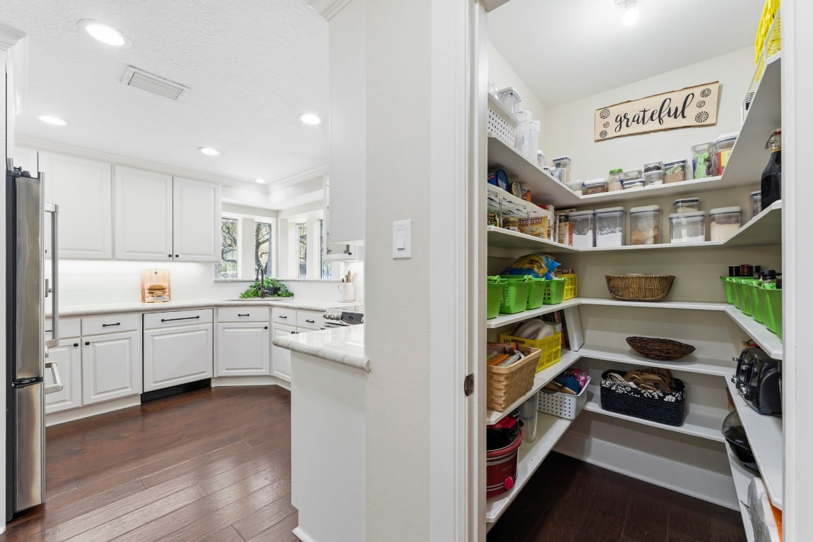 20 Falling Star Road The Woodlands, TX 77381 - Photo 17 of 44 A spacious, well-organized pantry with ample shelving and storage.