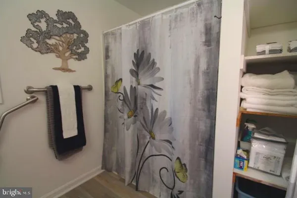 a bathroom with a shower and a sink