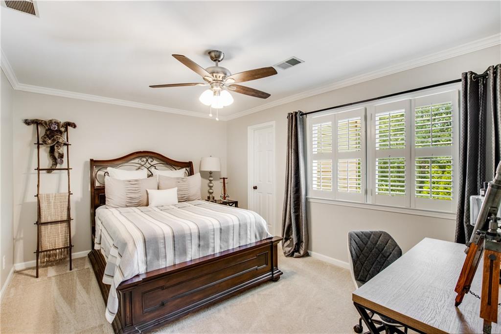 2995 Coles Way Atlanta, GA 30350 - Photo 23 of 44 a bedroom with a bed chair and window