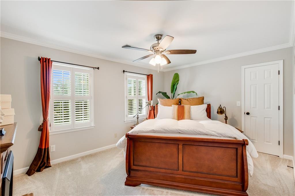 2995 Coles Way Atlanta, GA 30350 - Photo 25 of 44 a bedroom with a bed and a chandelier