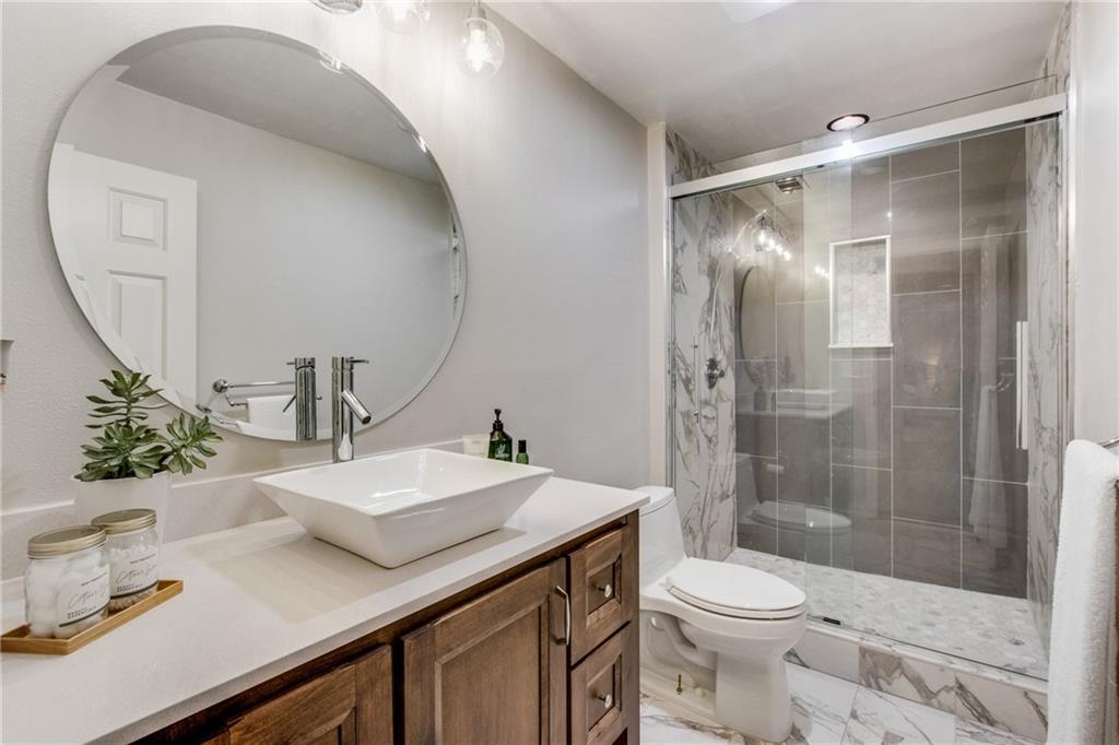 2995 Coles Way Atlanta, GA 30350 - Photo 30 of 44 a bathroom with a sink a toilet and shower