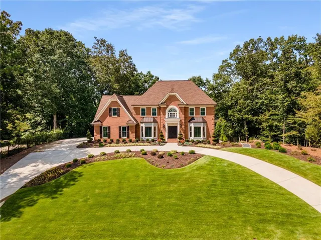 a front view of a house with swimming pool