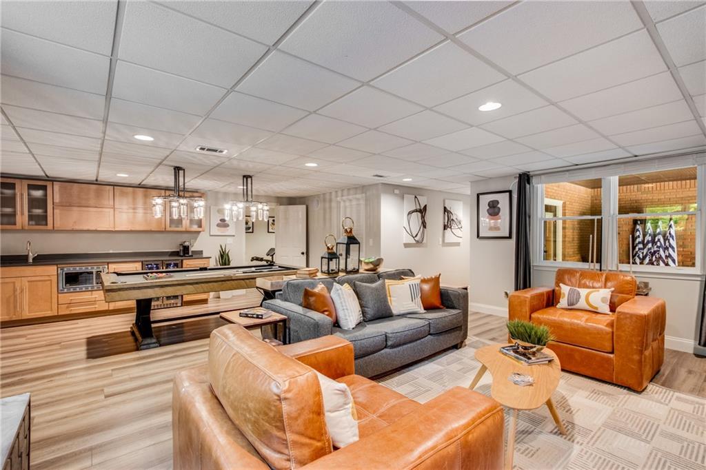 2995 Coles Way Atlanta, GA 30350 - Photo 34 of 44 a living room with stainless steel appliances furniture and a kitchen view