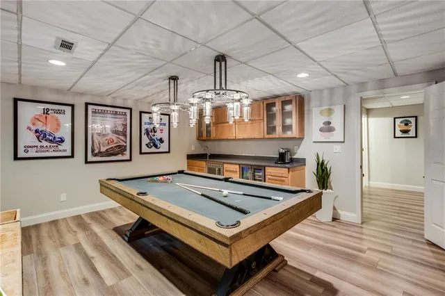 a living room with game table