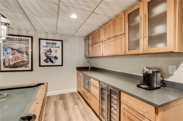 a kitchen with stainless steel appliances granite countertop a sink a stove and a microwave oven