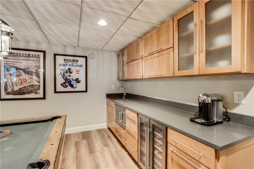 2995 Coles Way Atlanta, GA 30350 - Photo 36 of 44 a kitchen with stainless steel appliances granite countertop a sink a stove and a microwave oven