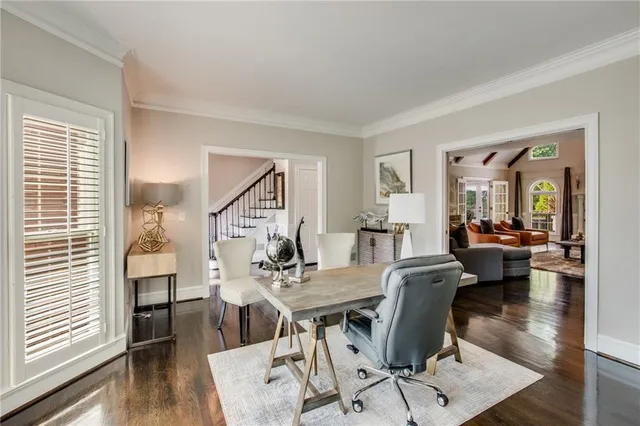 a view of a dining room with furniture wooden floor and a chandelier