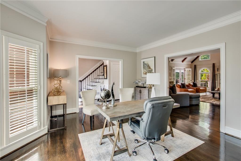 2995 Coles Way Atlanta, GA 30350 - Photo 6 of 44 a view of a dining room with furniture wooden floor and a chandelier