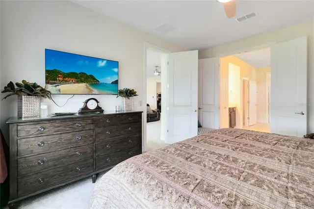 a bedroom with a bed and a dresser