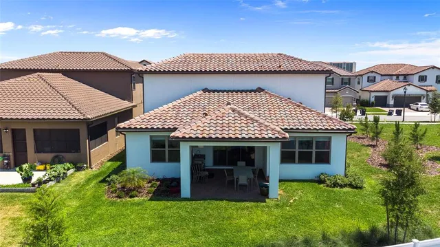 a front view of a house with a yard and porch