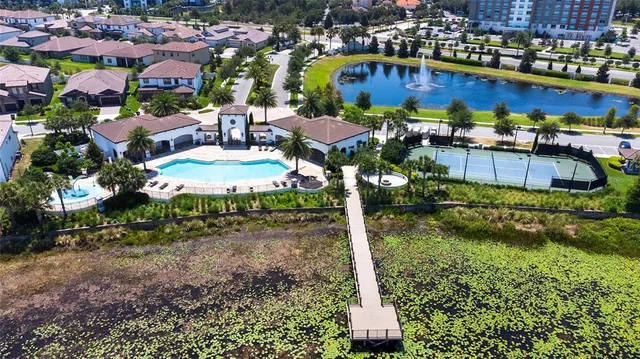 a view of a chairs and table in a backyard