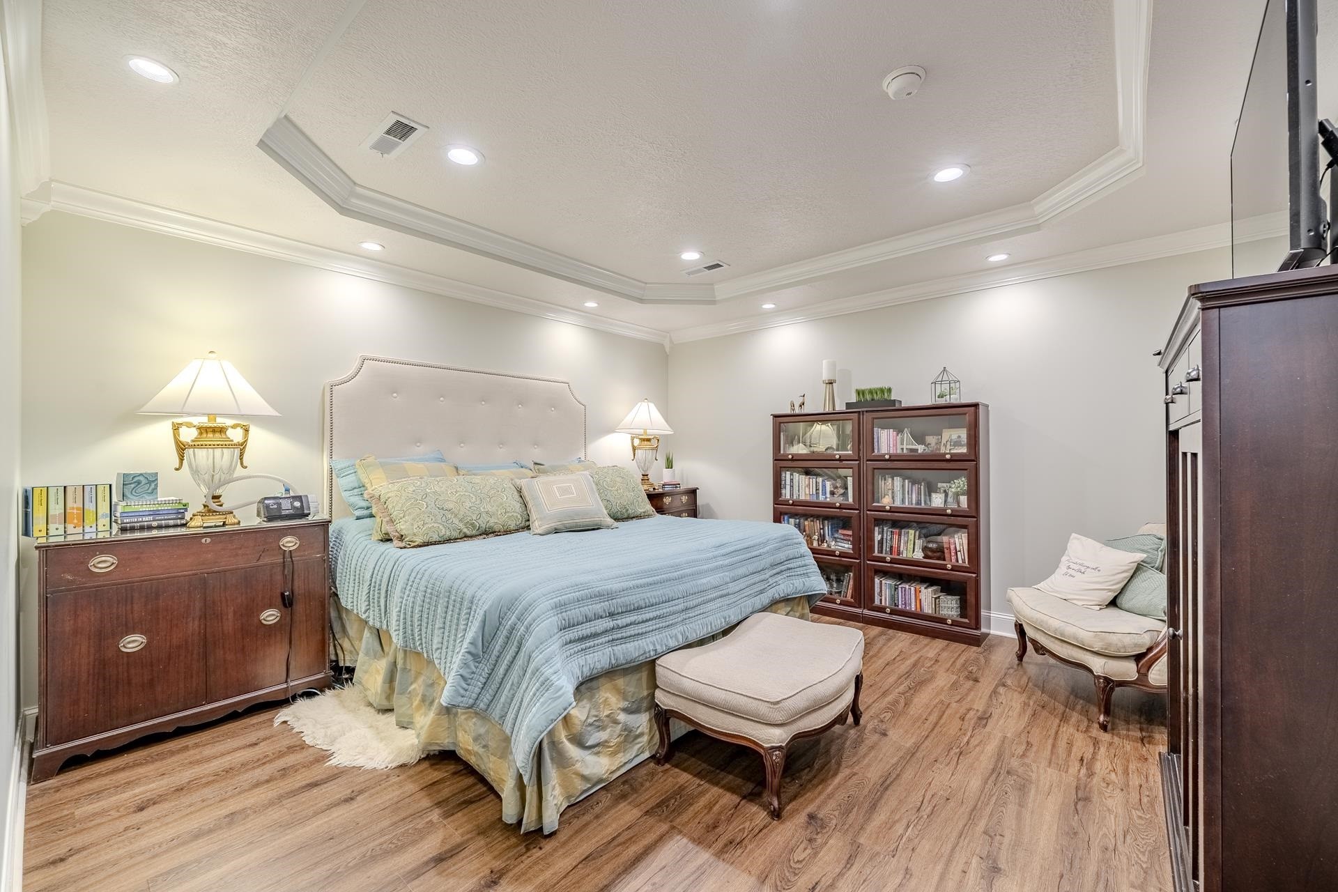 875 Faith Lane Savannah, TN 38372 - Photo 12 of 40 a bedroom with a bed and a book shelf