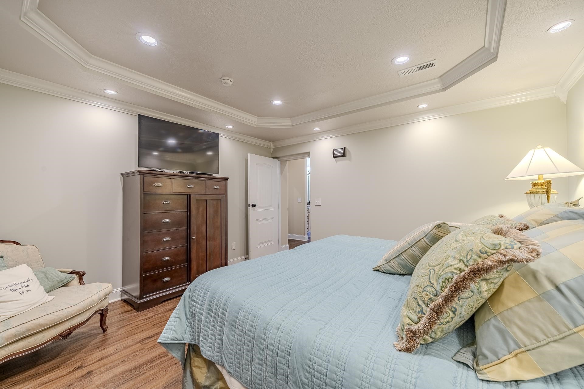 875 Faith Lane Savannah, TN 38372 - Photo 13 of 40 a bedroom with a bed and a dresser
