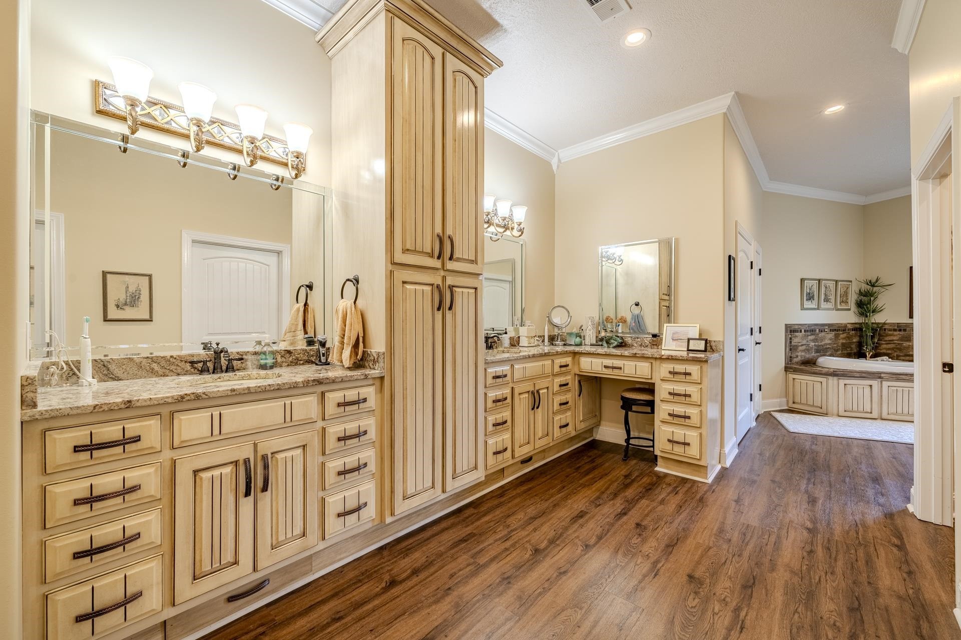 875 Faith Lane Savannah, TN 38372 - Photo 14 of 40 a kitchen with white cabinets and appliances