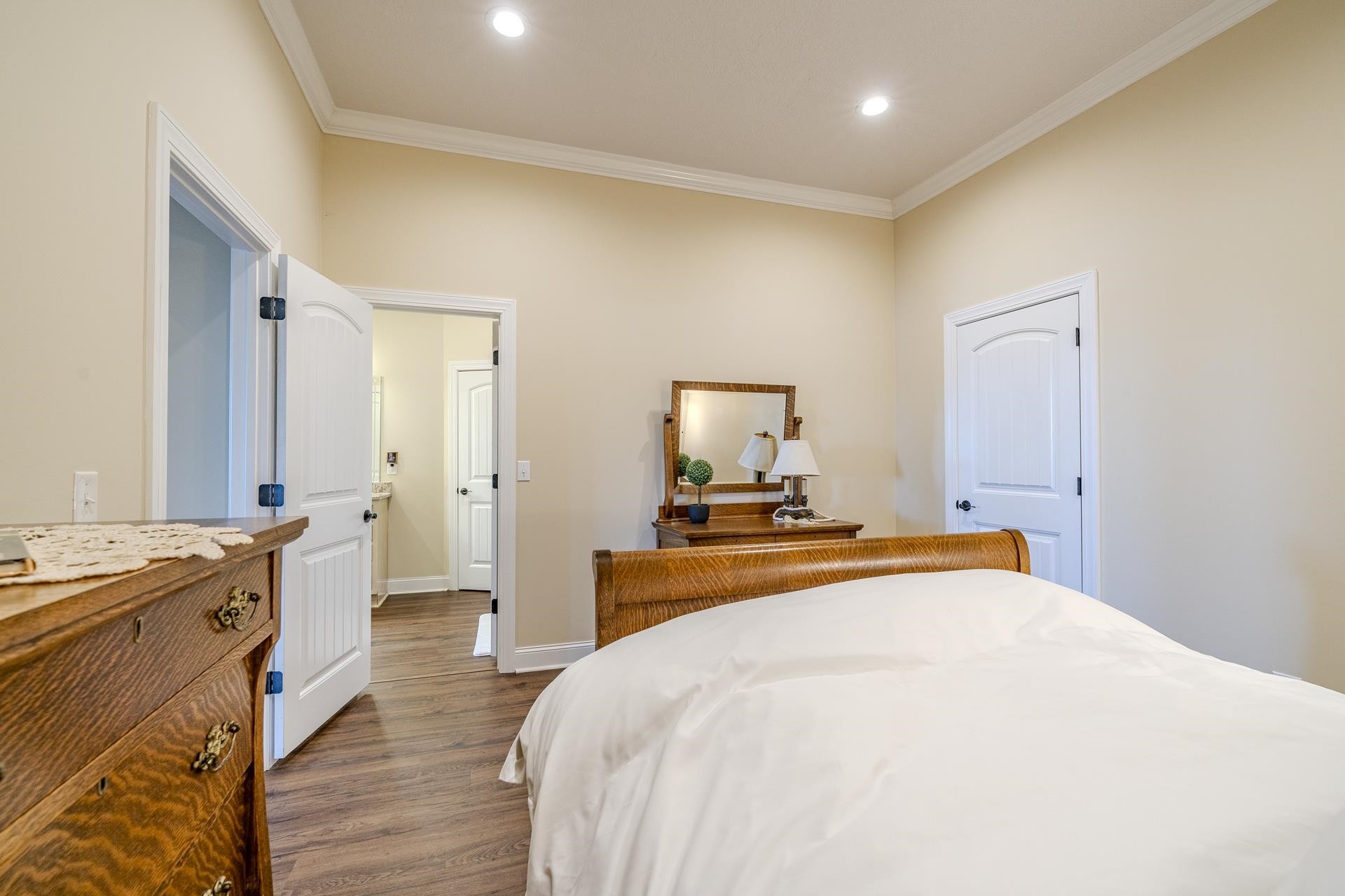 875 Faith Lane Savannah, TN 38372 - Photo 24 of 40 a bedroom with a bed and wooden floor