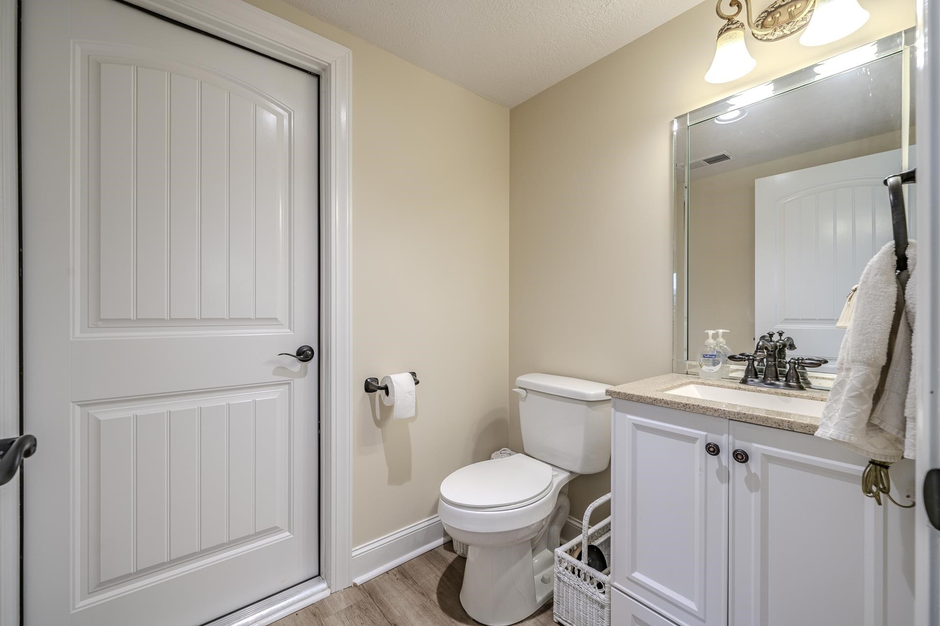 875 Faith Lane Savannah, TN 38372 - Photo 28 of 40 a bathroom with a toilet a sink and mirror