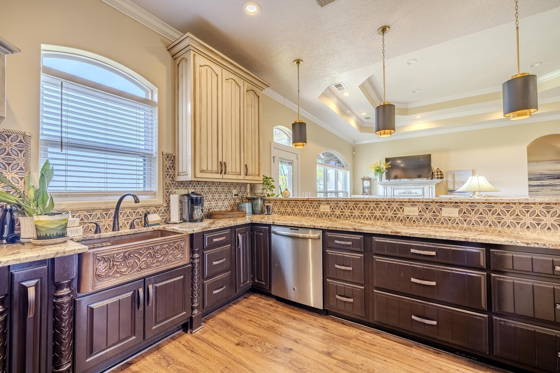 875 Faith Lane Savannah, TN 38372 - Photo 3 of 40 a kitchen with stainless steel appliances granite countertop wooden cabinets and a large window