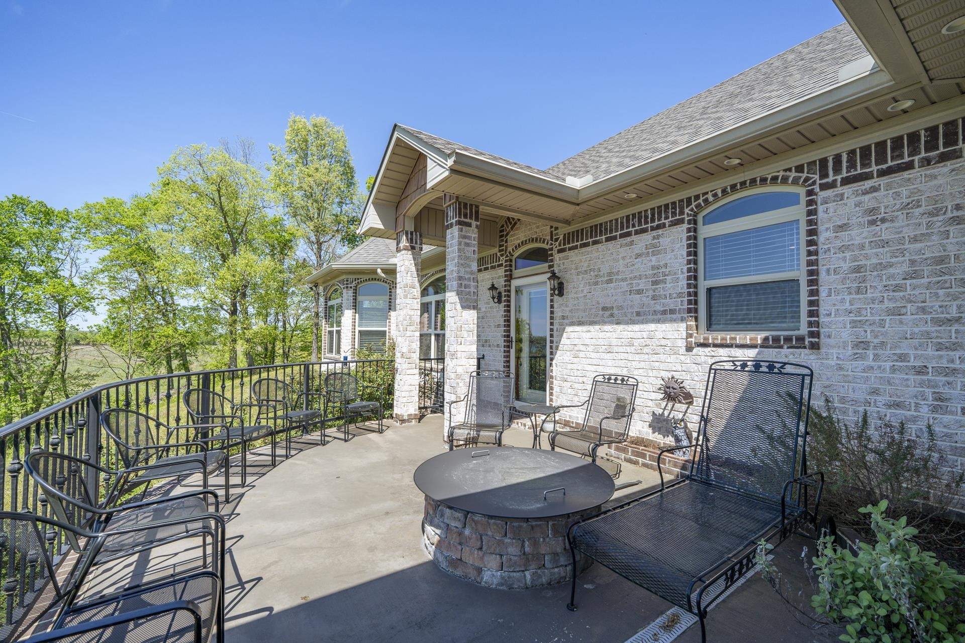 875 Faith Lane Savannah, TN 38372 - Photo 32 of 40 a backyard of a house with table and chairs