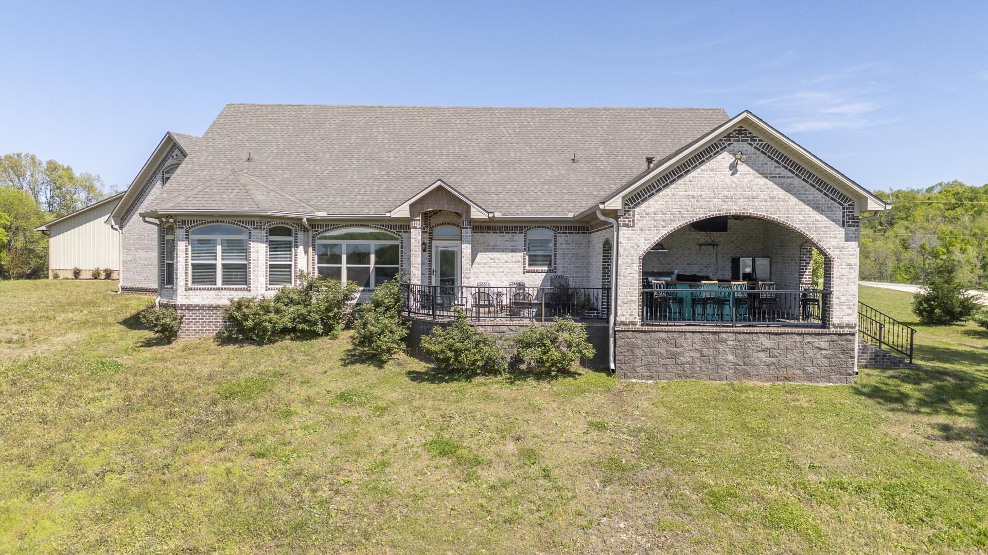 875 Faith Lane Savannah, TN 38372 - Photo 34 of 40 a front view of a house with garden