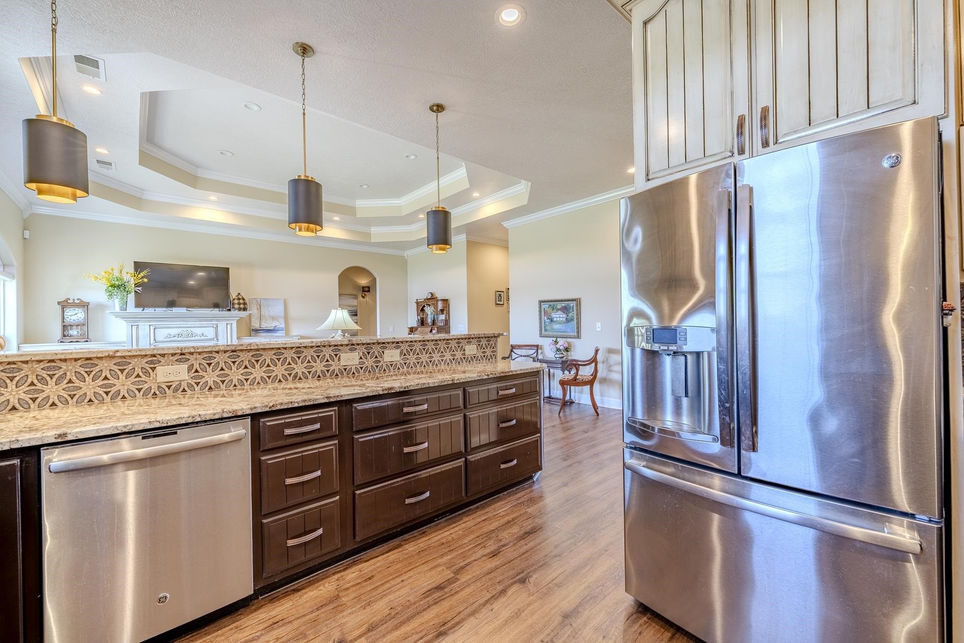 875 Faith Lane Savannah, TN 38372 - Photo 4 of 40 a kitchen with stainless steel appliances granite countertop a refrigerator a sink and a stove
