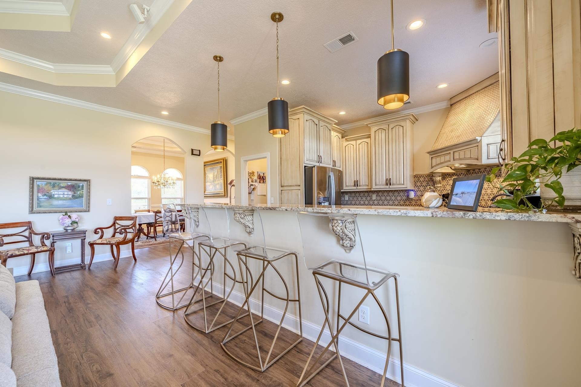 875 Faith Lane Savannah, TN 38372 - Photo 9 of 40 a view of a dining room with furniture and wooden floor