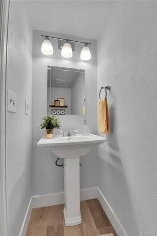 a bathroom with a sink and mirror