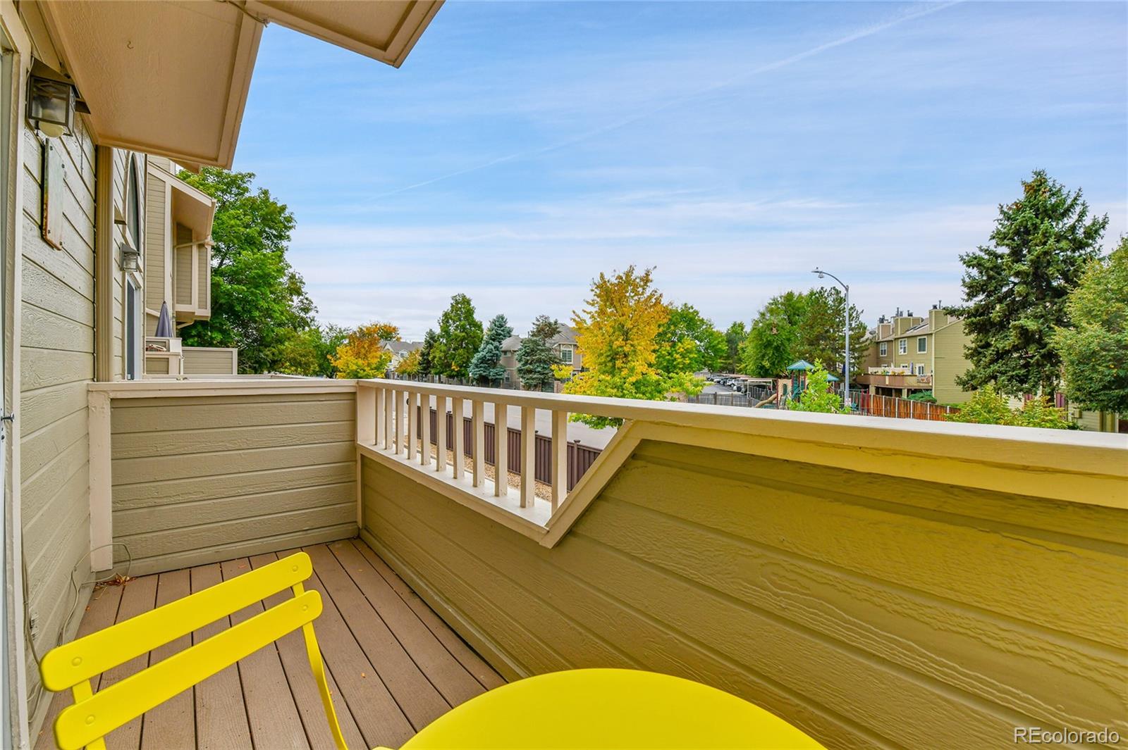1818 South Quebec Way, Unit 46 Denver, CO 80231 - Photo 14 of 34 a view of a balcony with two chairs