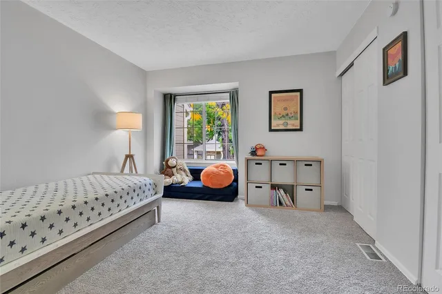 a bed room with furniture and a window