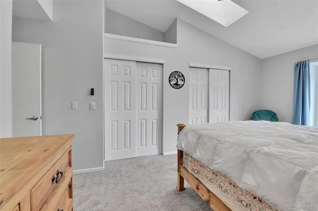 a bedroom with a bed and a table in it