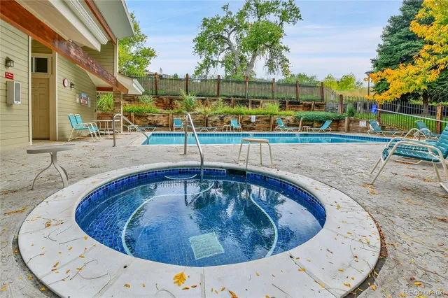 a view of a swimming pool with a patio