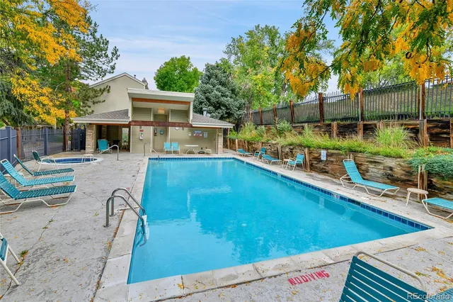 a view of a swimming pool with a patio