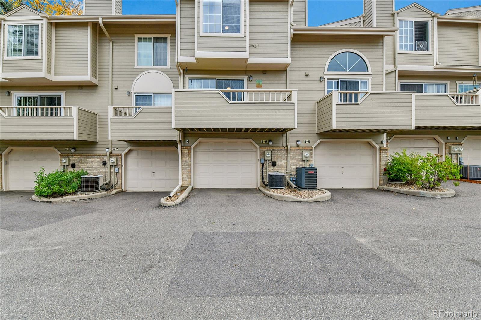 1818 South Quebec Way, Unit 46 Denver, CO 80231 - Photo 27 of 34 a view of a car parked in front of a building