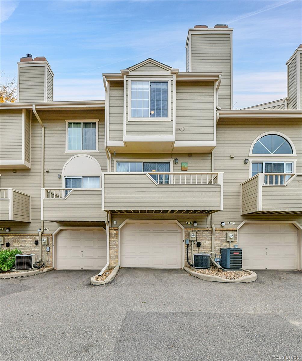 1818 South Quebec Way, Unit 46 Denver, CO 80231 - Photo 28 of 34 a front view of a house with parking
