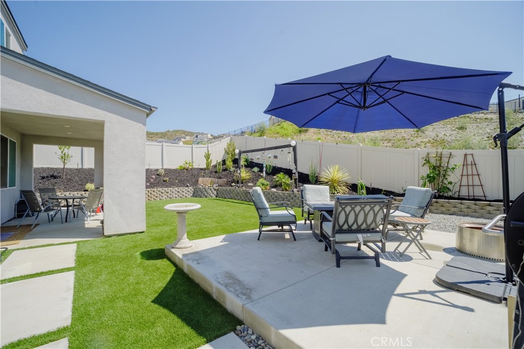 35323 Orchard Trail Fallbrook, CA 92028 - Photo 26 of 30 a view of a backyard with a patio and dining space