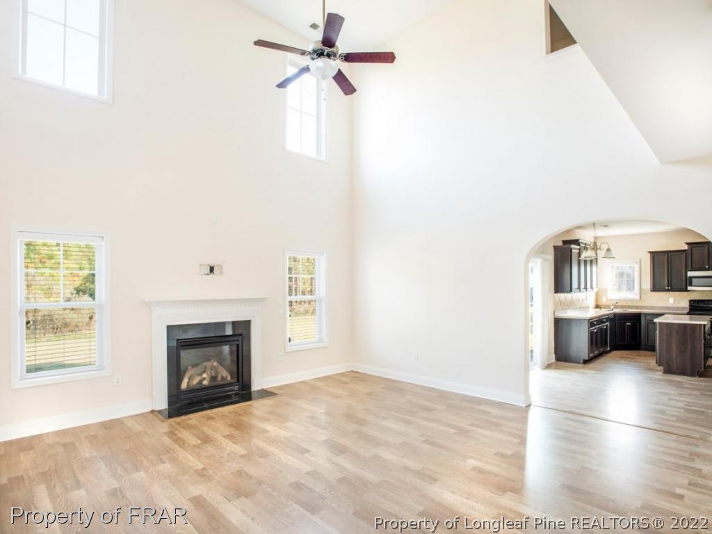 437 St Johns Loop Raeford, NC 28376 - Photo 10 of 35 a view of livingroom with furniture and a fireplace