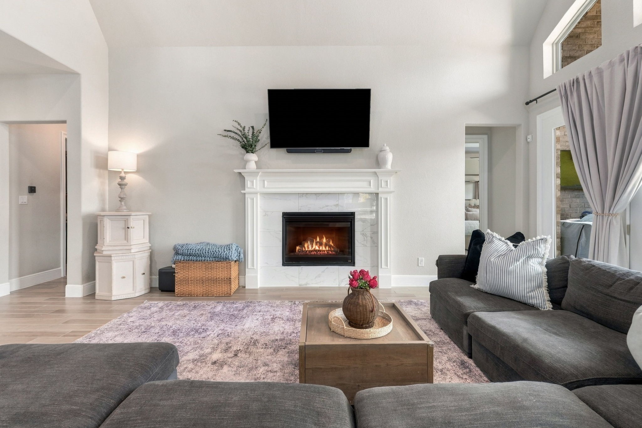 26910 Selinsgrove Road Magnolia, TX 77354 - Photo 14 of 47 The fireplace creates a defined focal point without overwhelming the open design.