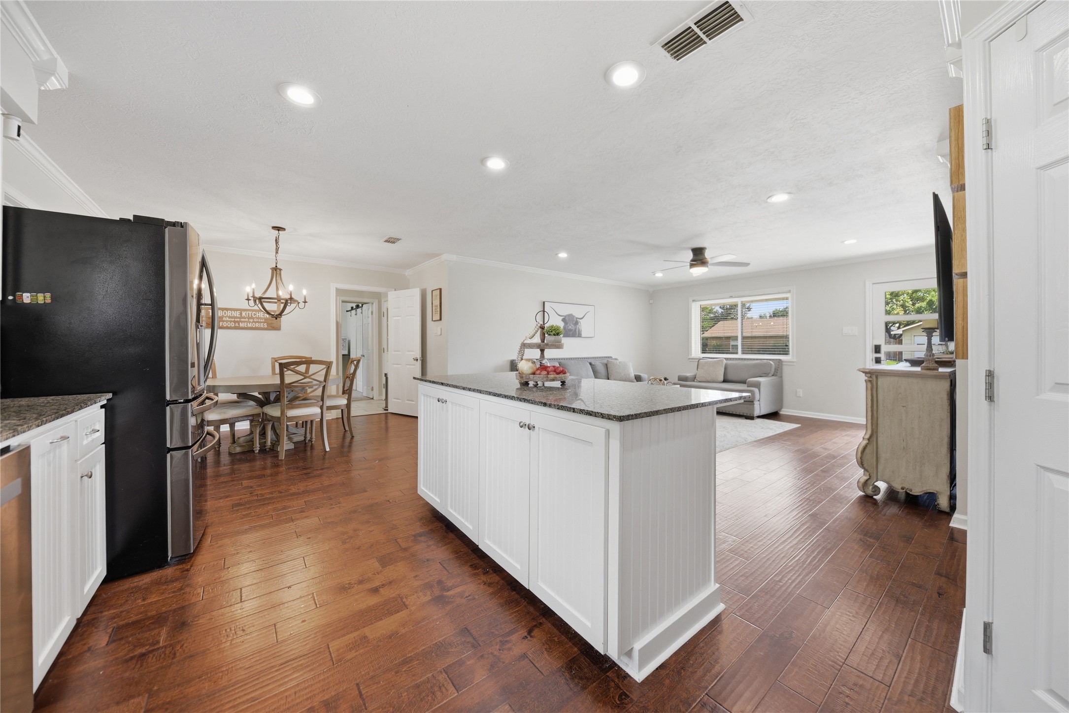 207 Briar Ridge Drive Bellville, TX 77418 - Photo 13 of 36 a kitchen with white cabinets and stainless steel appliances