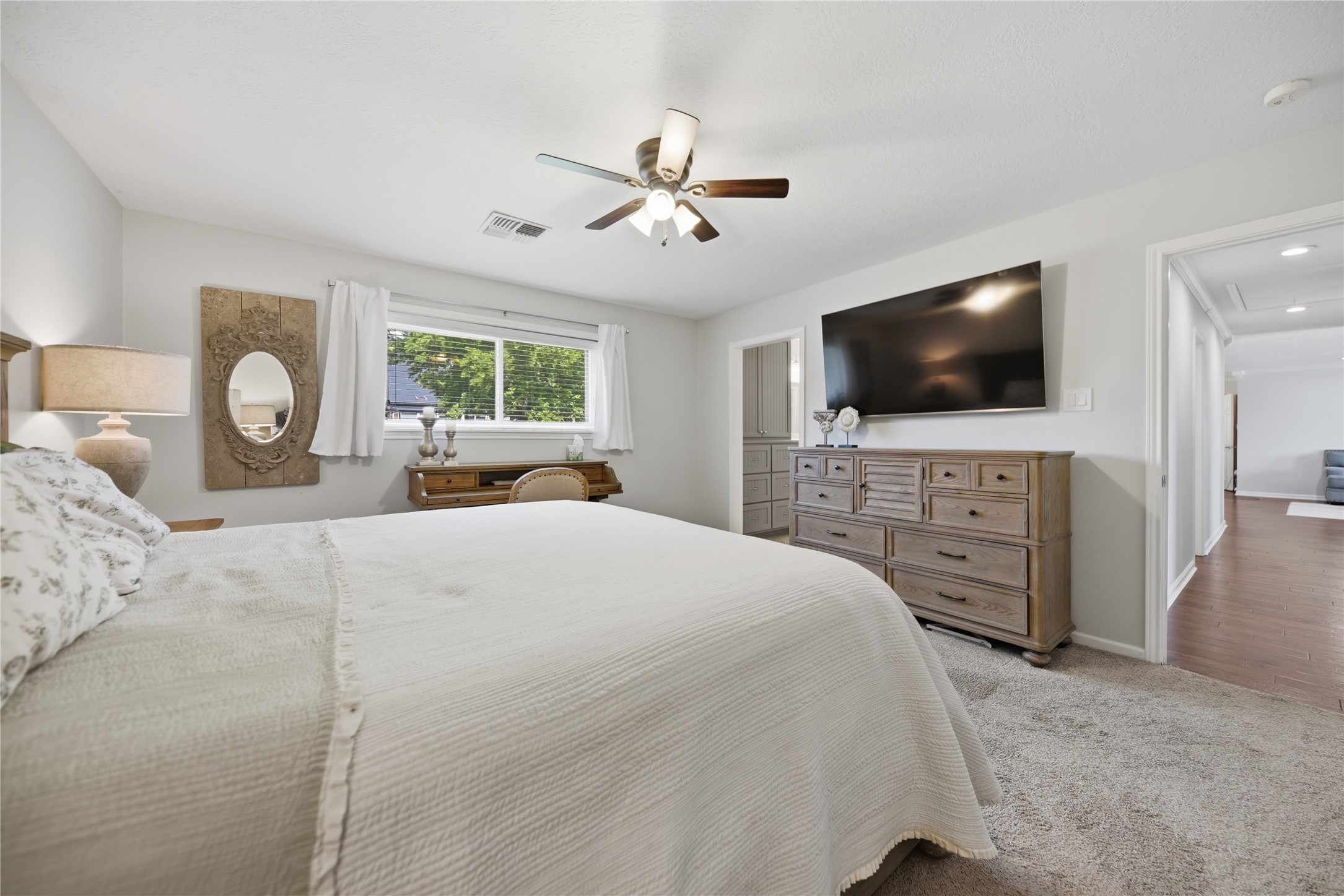 207 Briar Ridge Drive Bellville, TX 77418 - Photo 19 of 36 a bedroom with a bed and a flat screen tv