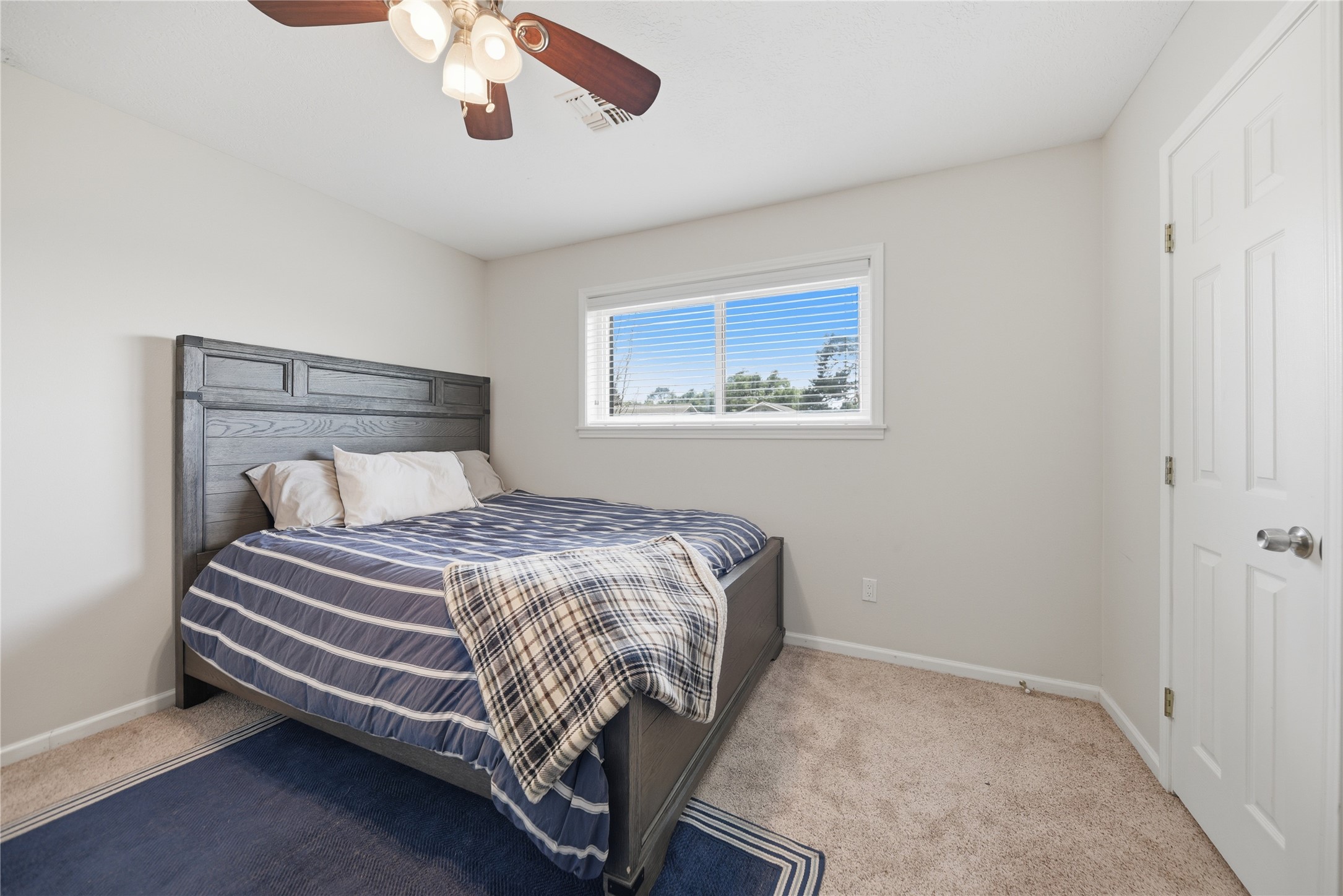 207 Briar Ridge Drive Bellville, TX 77418 - Photo 23 of 36 a bed sitting in a bedroom next to a bathroom